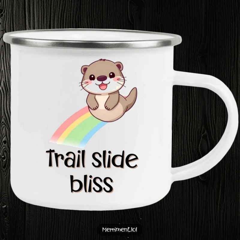 Funny enamel camping mug featuring a beaming otter sliding down a vibrant rainbow, perfect for outdoor fun.