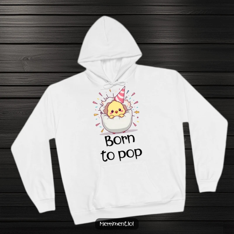 Funny chick hoodie with a fluffy baby bird peeking from a giant, exploding party popper, cozy and full of festive humor.