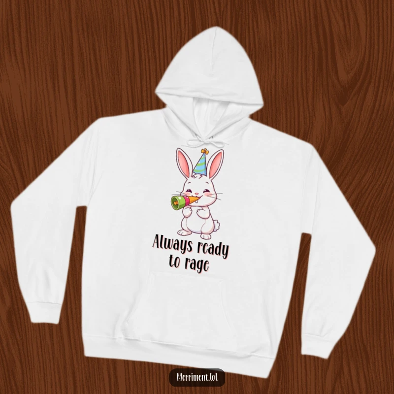 Funny hoodie with a cheerful bunny wearing a party hat, blowing a giant noisemaker, emanating cozy and festive vibes.