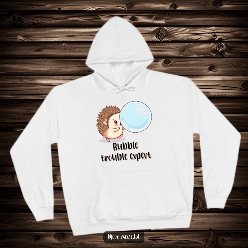 Funny hedgehog hoodie showing a fluffy animal eagerly chasing a comically large, bouncing soap bubble, offering cozy comfort and playful humor.