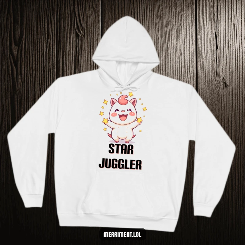 Funny Hoodie: A joyful creature happily juggles sparkling stars, showing a wide, infectious grin. A cozy and funny gift.