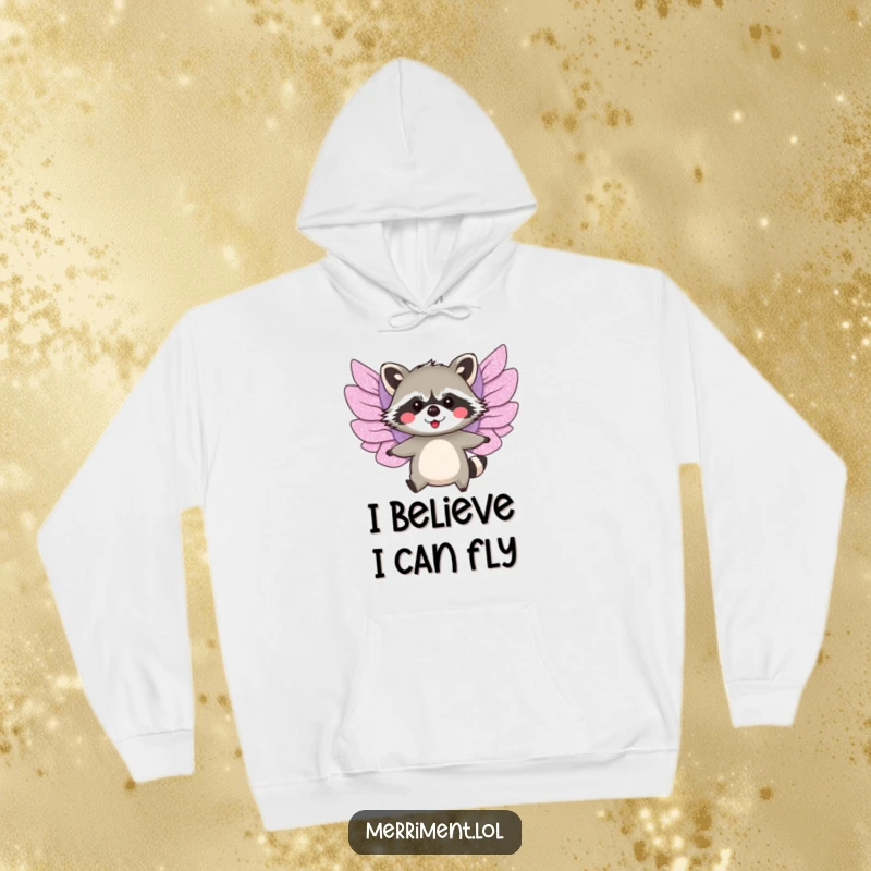 Funny hoodie featuring a blushing raccoon with oversized, glittery paper wings making a valiant attempt to fly.