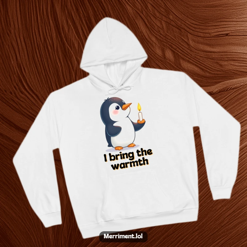 Funny hoodie featuring a curious penguin with a tiny, lit candle balanced carefully on its beak.