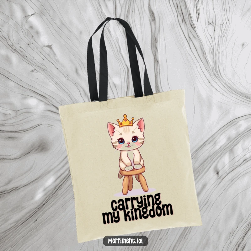 Funny tote bag illustrating a playful kitten wearing a tiny crown, balancing on a wobbly stool, perfect for carrying essentials with flair.